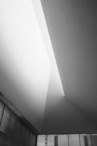 Light spilling through angled gaps in a ceiling.