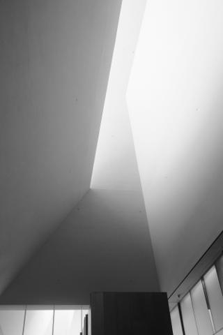 Light spilling through angled gaps in a ceiling.