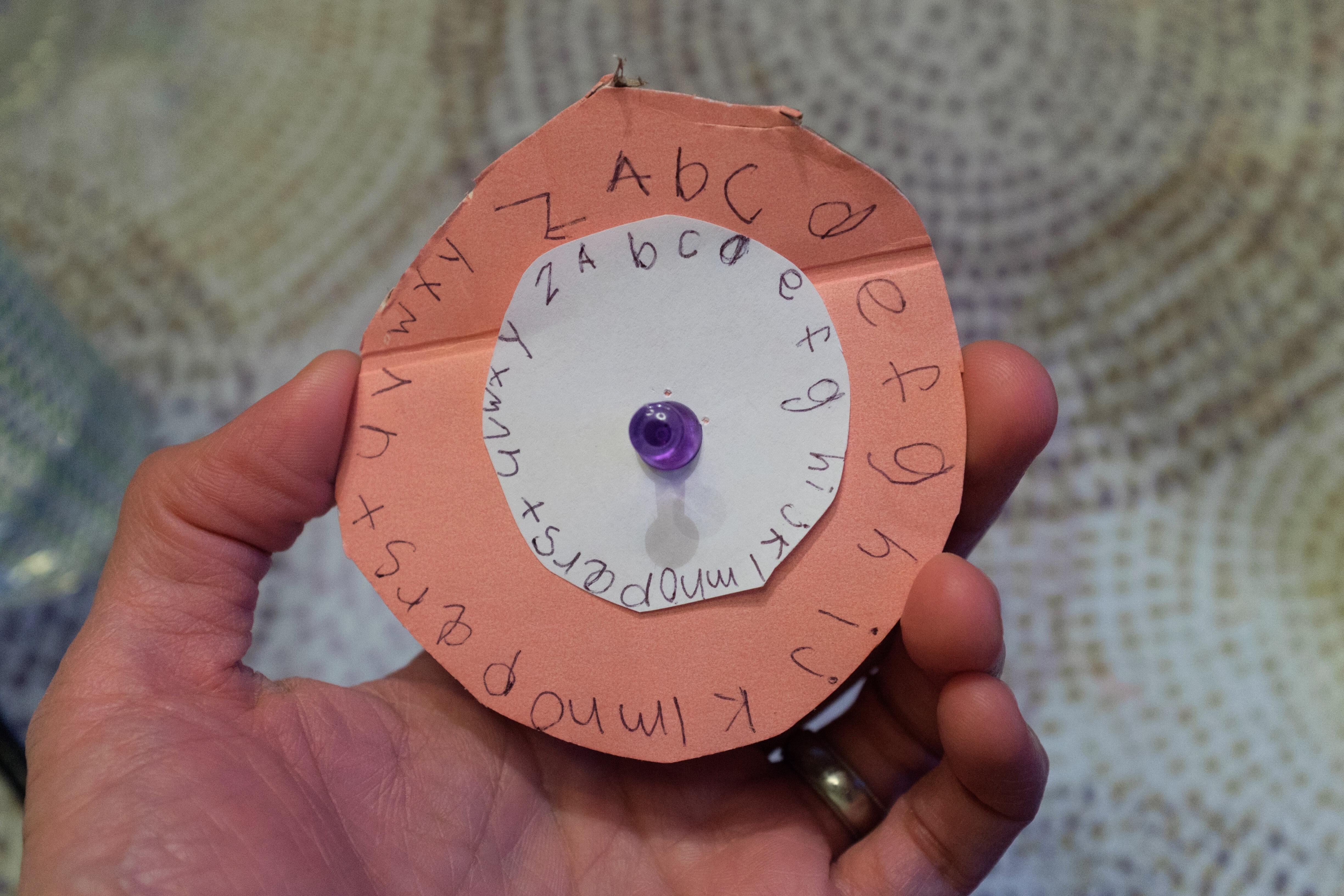 Closeup of a papercraft Caesar cipher wheel