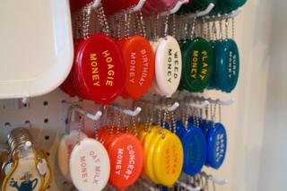 Coin purses with different slogans.