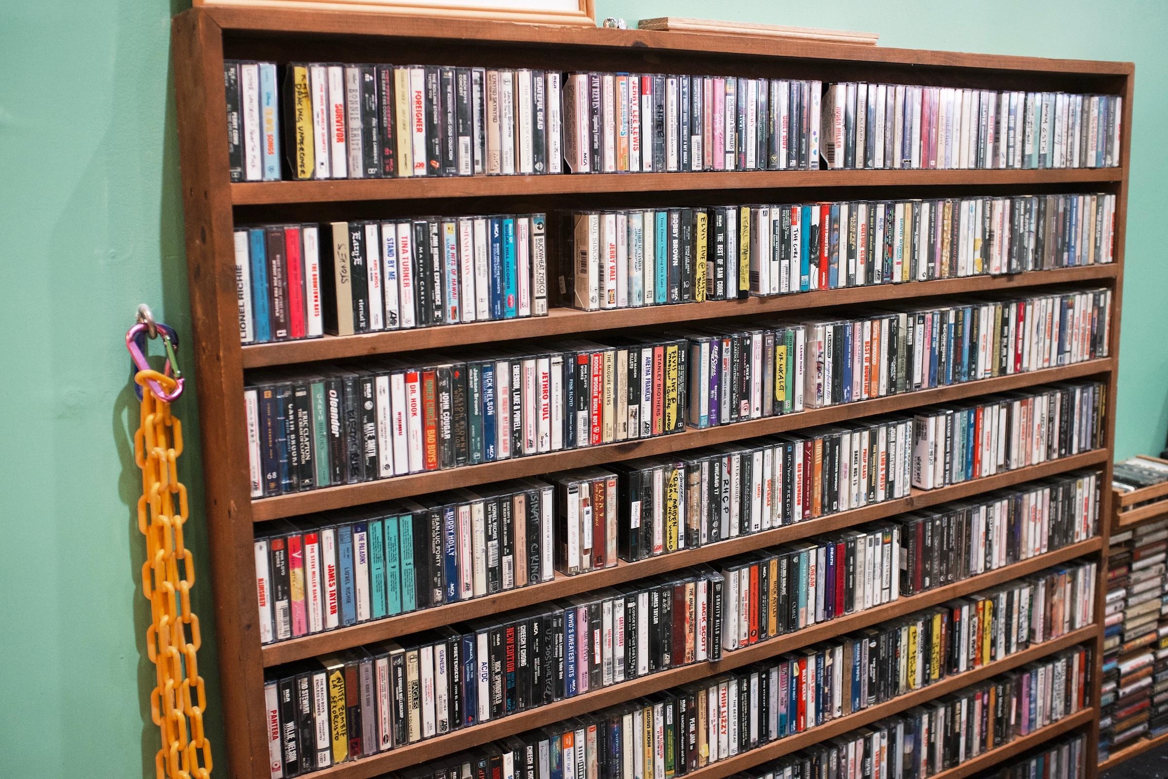 A shelf full of cassette tapes.