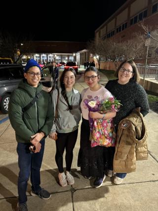 A family pose for a photo.