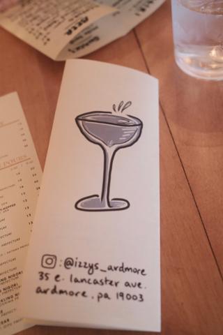 Bar menu with Izzy’s logo and Instagram handle.
