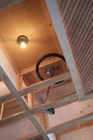 Unicycle in the roof rafters.