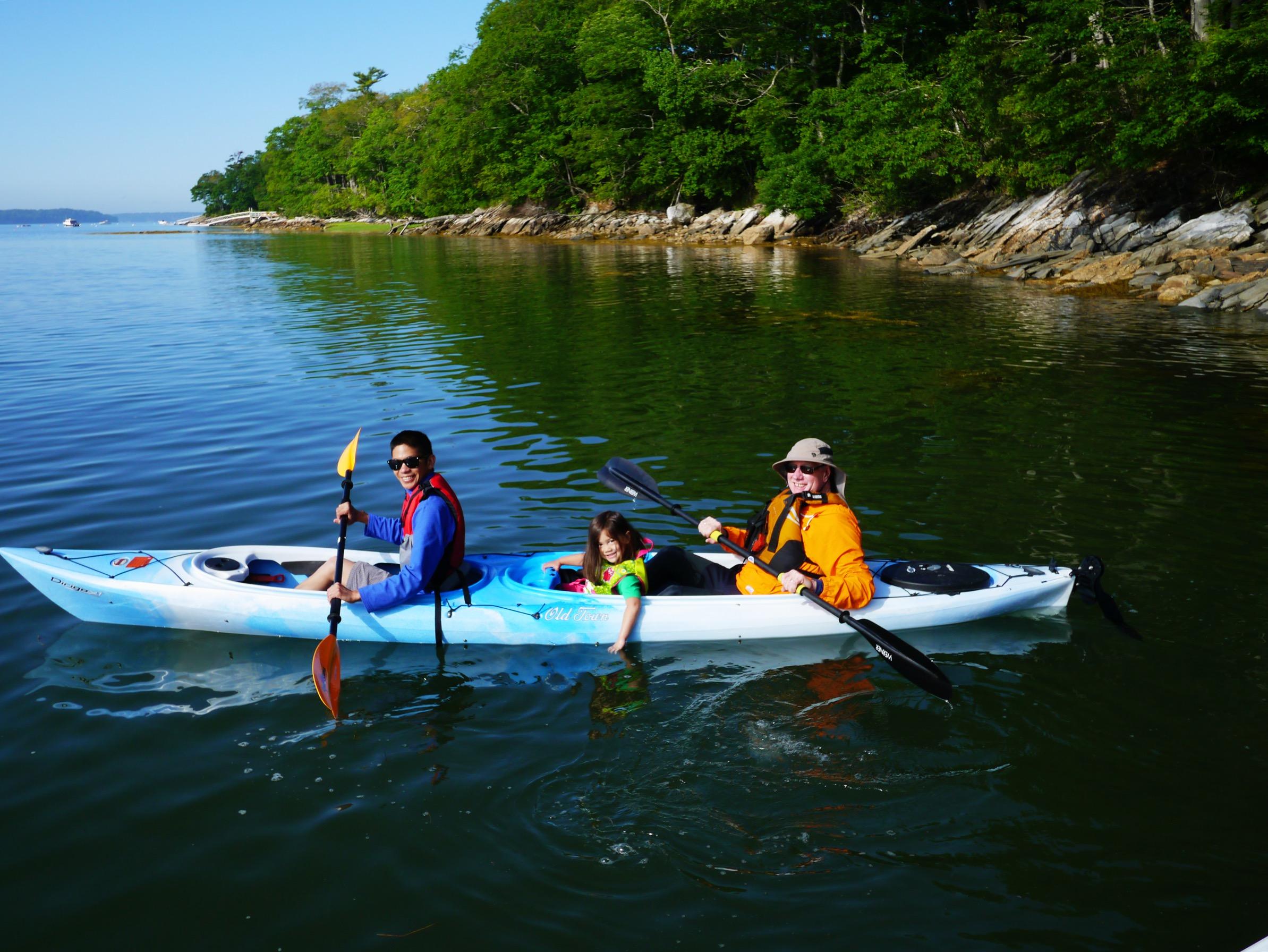 Three-person kayak on the water.