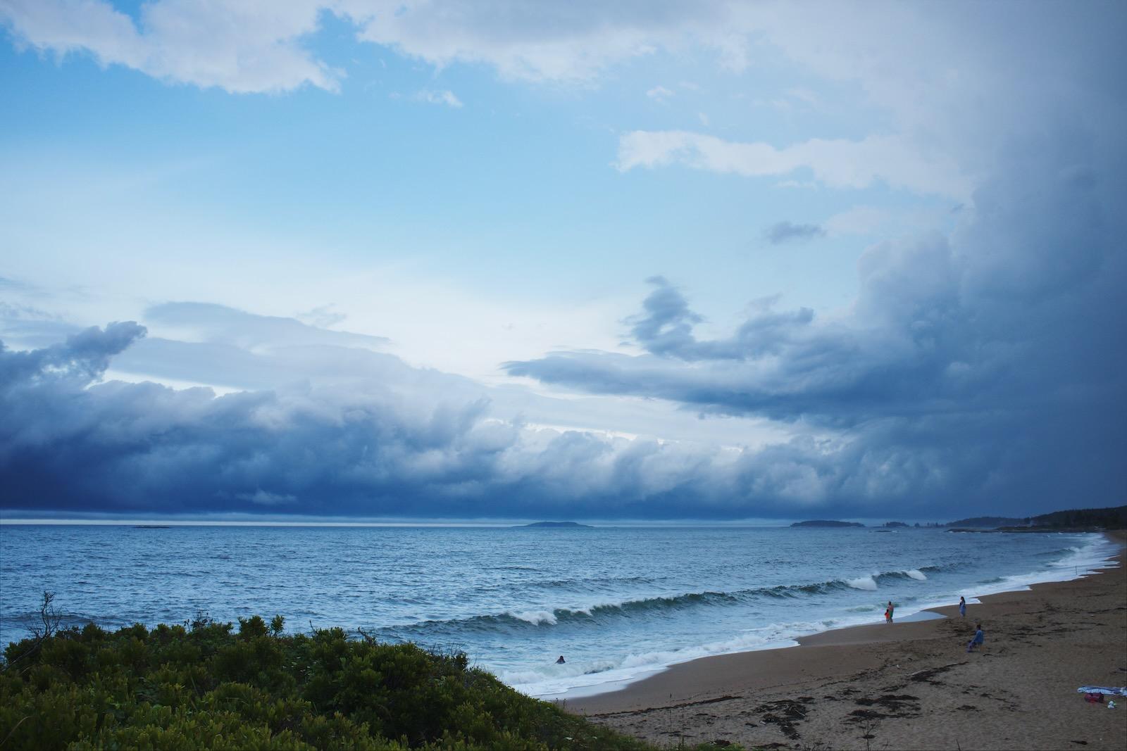 Storm clouds off a coast.