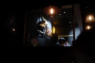 A dimly lit kitchen in a Japanese sake bar.