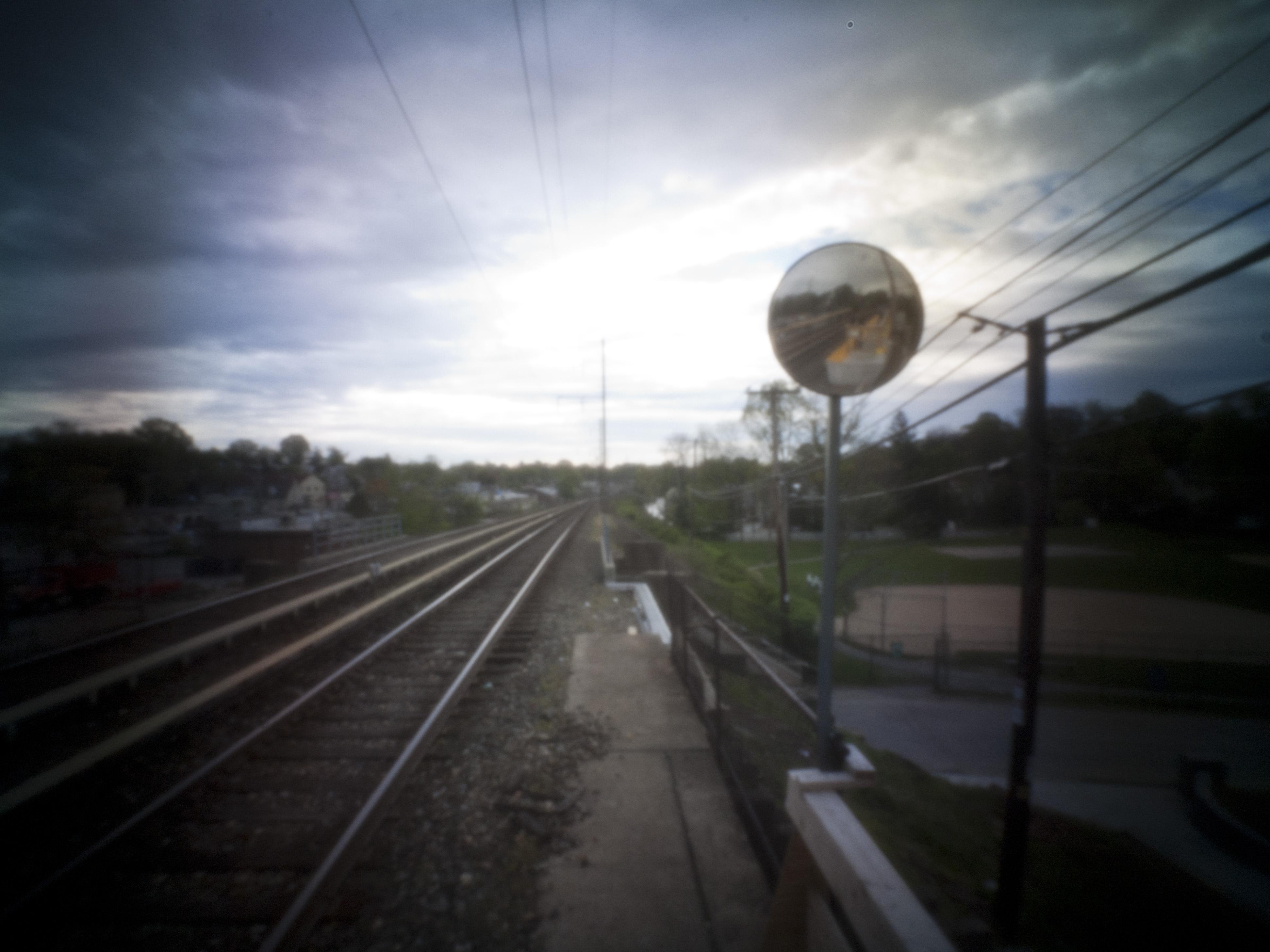 Pinhole photo of train tracks.