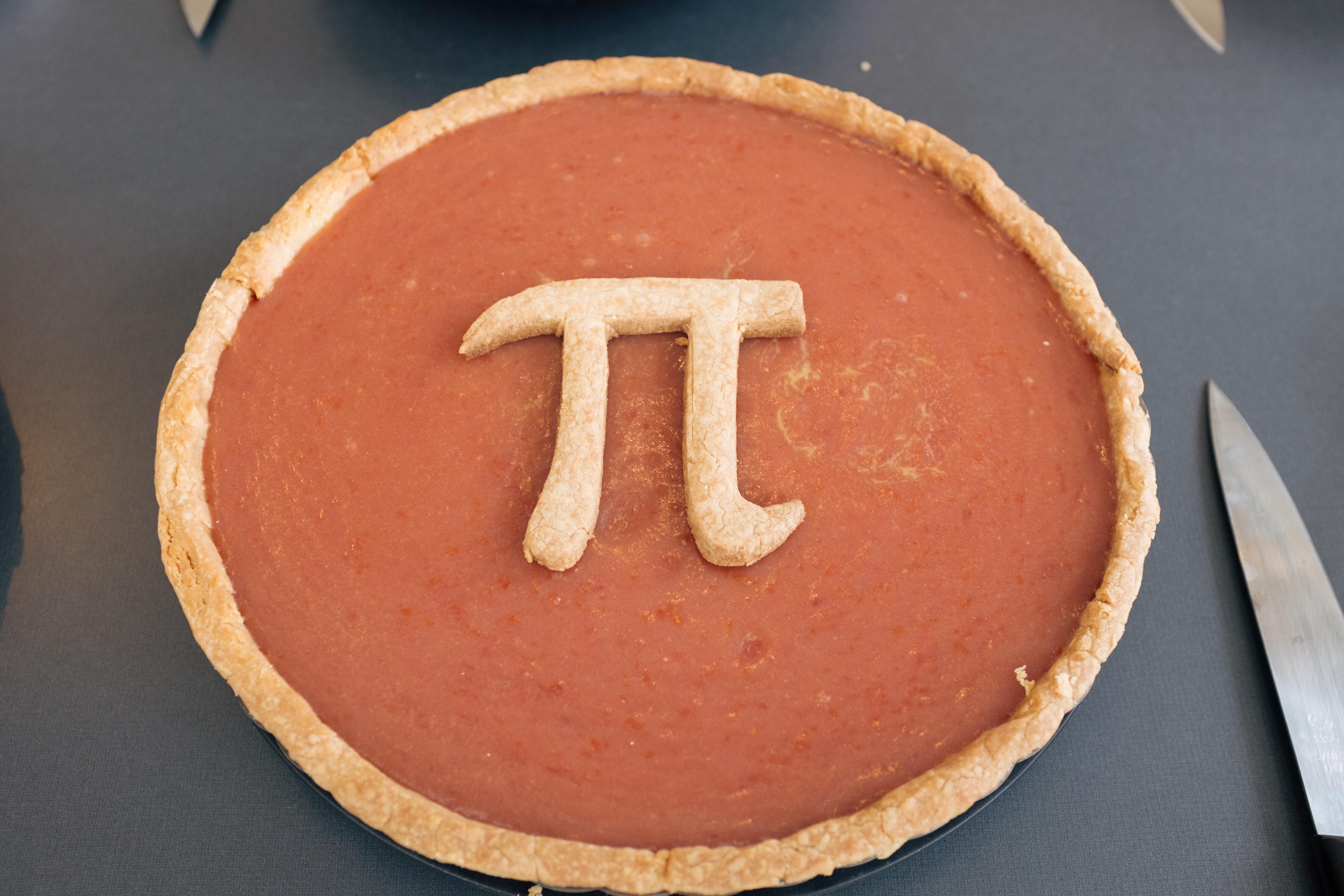 A blood orange curd pie with the pi symbol in the center.